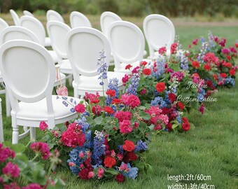 May include: White chairs arranged in rows on a grassy lawn, decorated with vibrant floral arrangements of red, pink, and blue flowers. The text "Jackon Customization" is visible. The floral arrangement is 2 feet long, 1.3 feet wide, and 1.8 feet high.