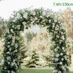 May include: A large, arched floral arrangement, approximately 200cm wide and 230cm tall, decorated with white flowers and green foliage. The arrangement is set outdoors, with the text "Jackon Customization" visible.