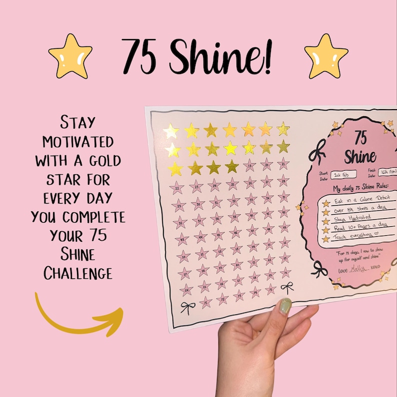 May include: A pink and white 75 Shine challenge chart with gold star stickers. The chart includes text that says "Stay motivated with a gold star for every day you complete your 75 Shine challenge."