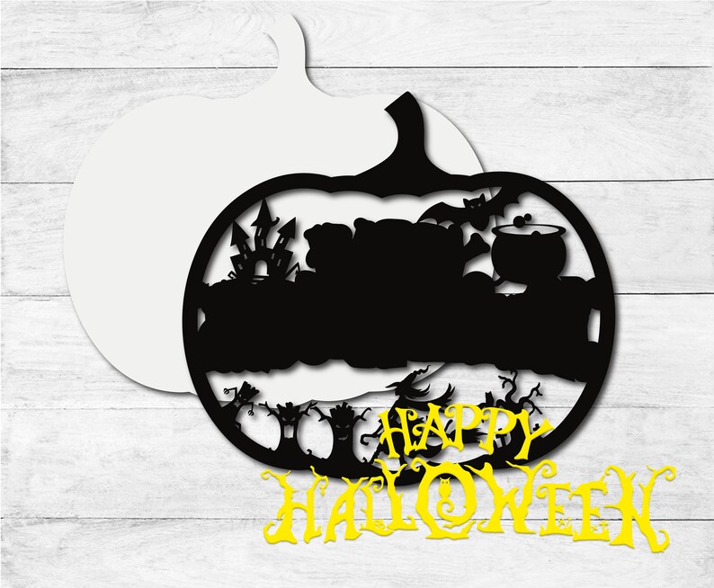 May include: Black silhouette of a pumpkin with a haunted house, bats, and a cauldron inside. The words "Happy Halloween" are written in yellow below the pumpkin.