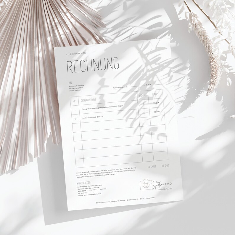 May include: A white invoice form with the heading "RECHNUNG" in black text. The form includes sections for "AN", "DIENSTLEISTUNG", "PREIS", and "SUMME". The bottom of the form includes contact information for "Studio Name Here" and a logo with a camera icon.