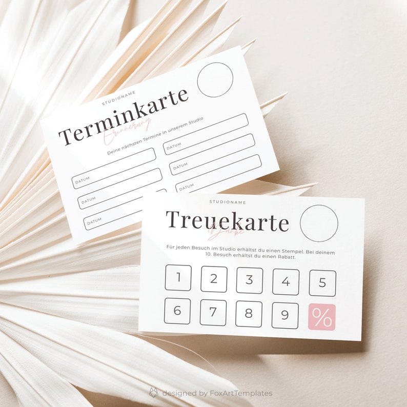 May include: Two white cards with black text. The top card is a "Terminkarte" with a space for a studio name and a section for scheduling appointments. The bottom card is a "Treuekarte" with a space for a studio name and a section for collecting stamps for a discount. The text on the cards is in German.