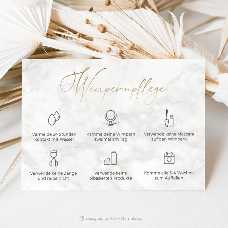 May include: A white marble-textured card with gold text that reads "Wimpernpflege" and outlines lash care tips in German. The tips include avoiding water contact for 24 hours, brushing lashes twice a day, avoiding mascara, avoiding oil-based products, and getting refills every 3-4 weeks.