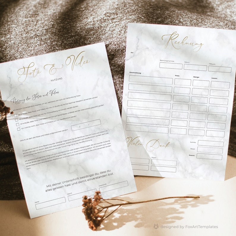 May include: A white and gray marble-patterned document with the word "Rechnung" (German for invoice) written in gold cursive script. The document has a table with columns for description, price, quantity, and total. The document also includes a section for the customer's name, address, and payment information.