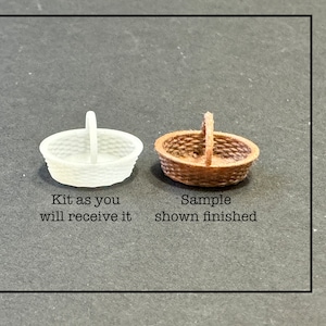 May include: A white plastic basket kit and a brown finished basket. The text "Kit as you will receive it" is below the white basket and the text "Sample shown finished" is below the brown basket.