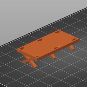 May include: A 3D-rendered, orange-brown miniature picnic table. The table has a rectangular top with rounded corners and four recessed areas. The legs are crossed for support, creating a small, sturdy design.