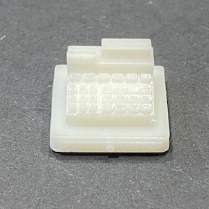 May include: White plastic cash register toy with a raised keyboard and a small display area.