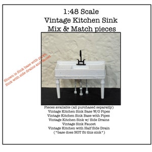 May include: White miniature kitchen sink with a black faucet and a white base. The sink is 1:48 scale and is part of a mix and match set. The text on the image reads: "1:48 Scale Vintage Kitchen Sink Mix & Match pieces Shown is Sink base with pipes, Sink with side drains and faucet Pieces available (all purchased separately) Vintage Kitchen Sink Base W/O Pipes Vintage Kitchen Sink Base with Pipes Vintage Kitchen Sink w/ Side Drains Vintage Sink Faucet Vintage Kitchen with Half Side Drain (*base does NOT fit this sink*)"