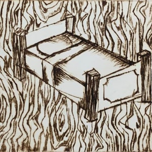 May include: A black and white line drawing of a bed on a wood grain background.