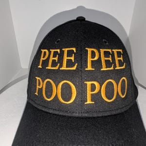 May include: A black baseball cap with the words "PEE PEE POO POO" embroidered in yellow.