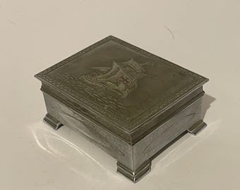1940s metal cigarette box with embossed Galleon ship design on lid and wooden lining inside - no makers mark
