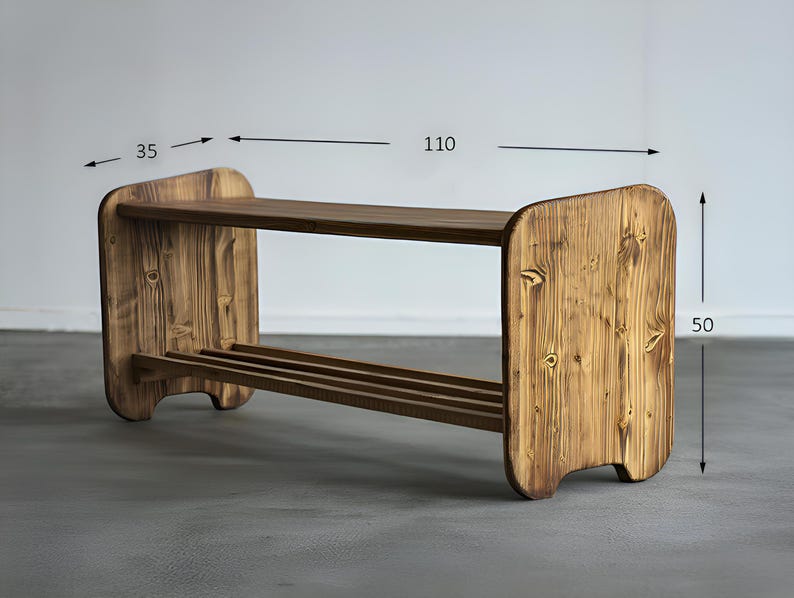 May include: A wooden shoe rack with a rustic finish. The rack has two shelves and measures 43 inches long, 14 inches wide, and 20 inches high. The wood grain is visible, and the design is simple and functional.