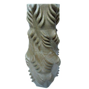 May include: A tall, ceramic vase with a textured, organic design. The vase is a light brown color with a speckled glaze.