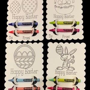 May include: Four blank coloring cards with a Happy Easter message and a different Easter-themed image on each card. Each card has a slot to hold three crayons. The crayons are included.