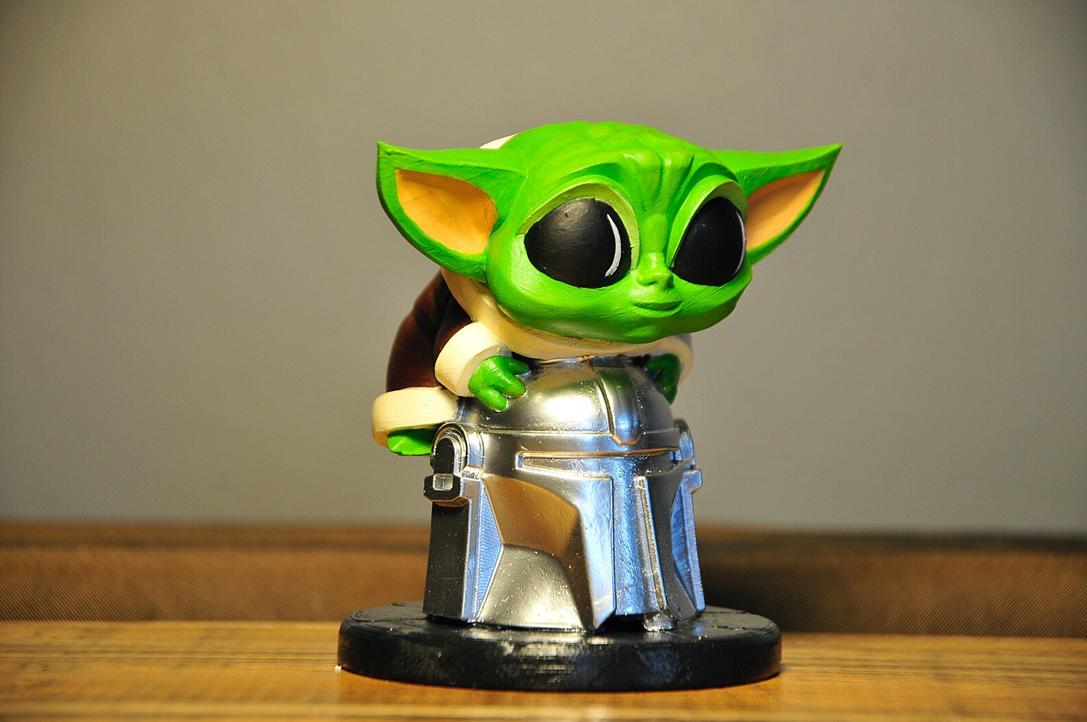 Baby Yoda Sitting on Mandalorian Helmet Tabletop Figure Etsy
