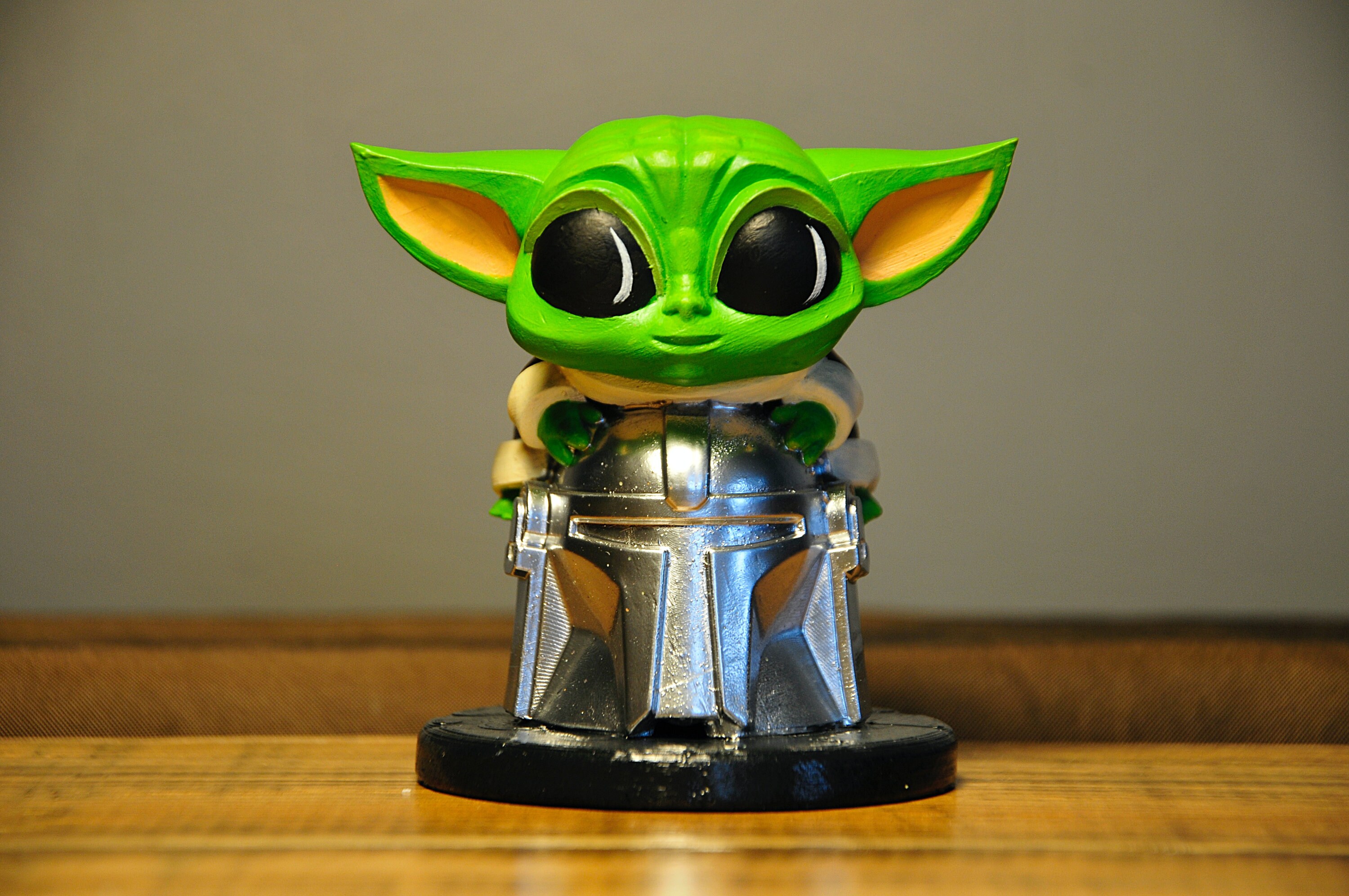 Baby Yoda Sitting on Mandalorian Helmet Tabletop Figure Etsy