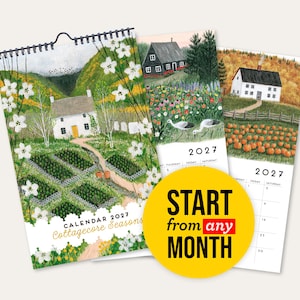 May include: A 2027 wall calendar titled Cottagecore Seasons featuring illustrated rural landscapes with white houses, gardens, and fields. A yellow circular sticker overlays the pages with the black and red text START from any MONTH.