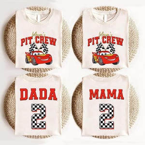 a set of three personalized onesuits with cars on them