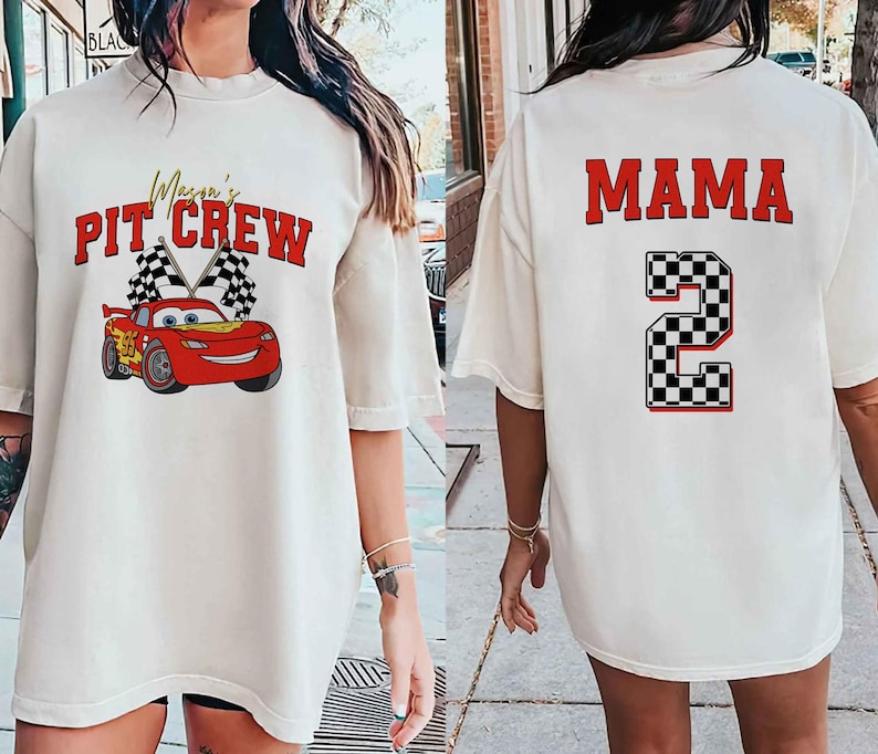 a woman wearing a white shirt with a red car on it