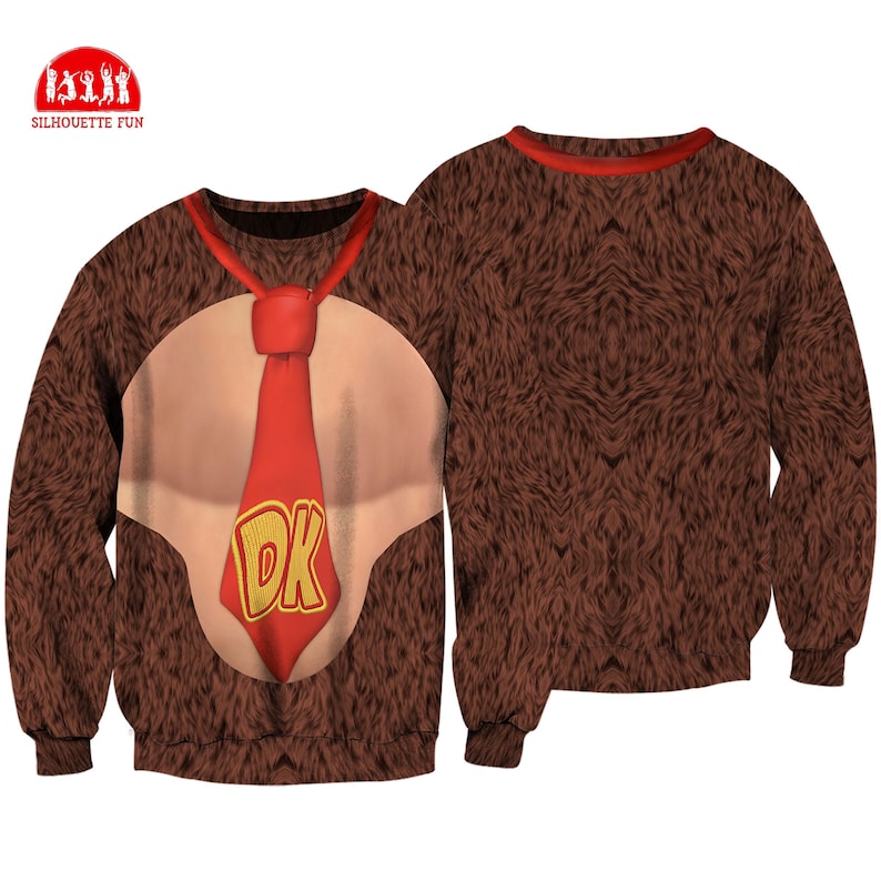 May include: Brown sweatshirt featuring a design inspired by a video game character. The front displays a tan chest, a red tie with "DK" in gold letters, and brown fur. The back of the sweatshirt is solid brown fur. The brand logo "SILHOUETTE FUN" is in the upper left corner.