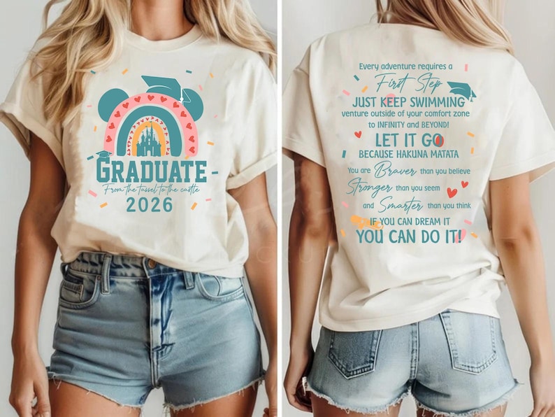 a white t-shirt with a graphic design and text on it. The design includes a castle and a rainbow, and the text on the back of the t-shirt reads "Graduate - From the tent to the castle - 2026".