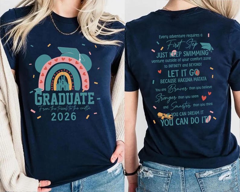 a woman wearing a blue t-shirt with a colorful graphic and text on it.