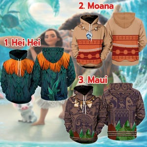 a collection of three hooded sweatshirts, each featuring different designs and patterns related to the Disney movie "Moana". The first sweatshirt is a green and orange design, the second is a brown and orange design, and the third is a brown and green design. The sweatshirts are labeled with the names of the characters Moana and Hei Hei Hei, indicating their design inspiration.