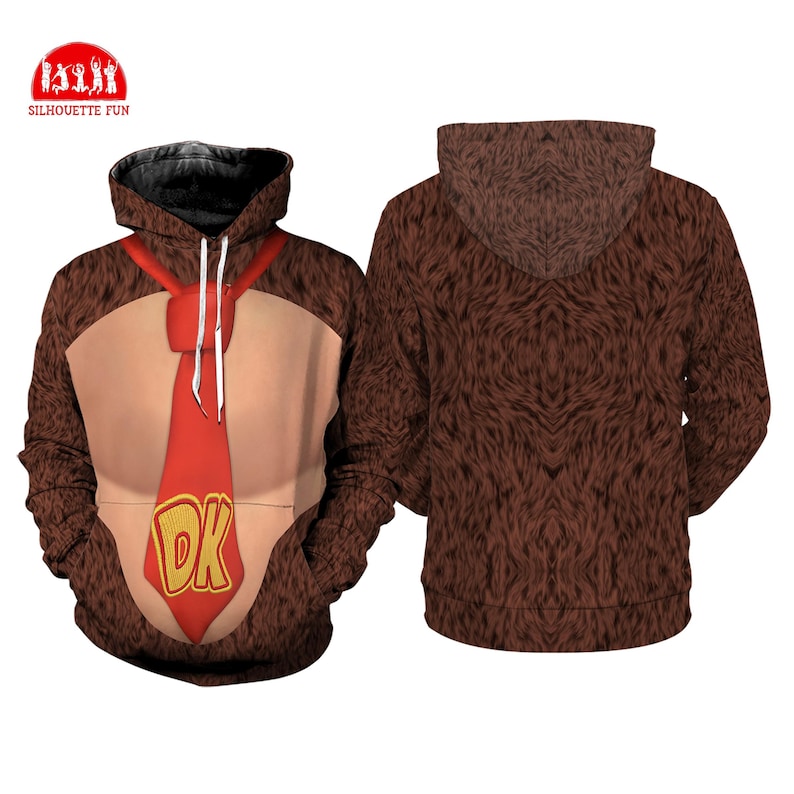 May include: Brown hooded sweatshirt with a design resembling a cartoon character. The front features a tan chest area, a red tie with "DK" in yellow, and a brown fur-like texture. The back of the sweatshirt is entirely brown and fur-like.