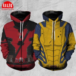May include: Two zippered hoodies with a superhero theme. One is red and black with a Deadpool design. The other is yellow and blue with a Wolverine design. Both hoodies have a zipper closure and a hood.
