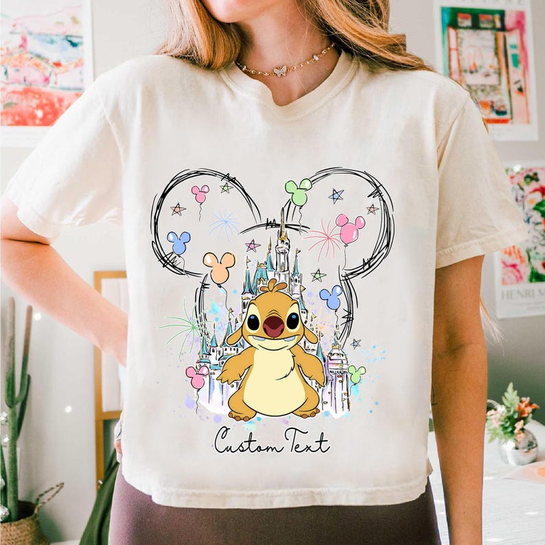 a woman wearing a mickey mouse shirt