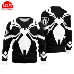 a black and white sweater with a unique design resembling a spider or a web. The sweater has a prominent white spider or web pattern on the front and back, and it is displayed in two different views, including the front and back.