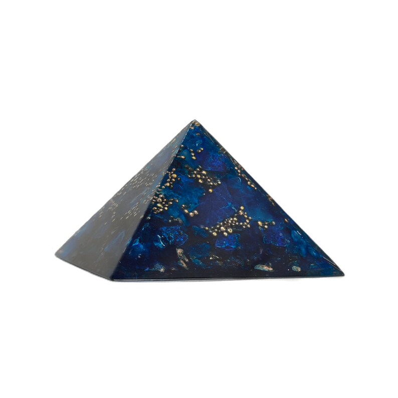 May include: A decorative pyramid with a dark blue and gold speckled design. The pyramid shape is a classic geometric form, and the color scheme gives it a luxurious appearance. The pyramid is a unique home decor item.
