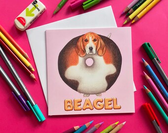 Tarjeta de felicitación ilustrada con un divertido juego de palabras sobre perros, un bagel de beagle, interior en blanco.