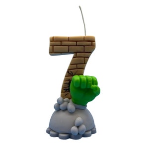 Handmade birthday candle character inspired, brick texture on clay handmade number age, with grey base and sculpted rocks and green hand. cake topper for birthday decor, boys birthday party, personalized keepsakes