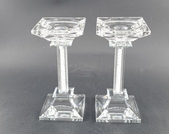 Set of two crystal pilar candle holders filled with small crystals