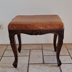 Vintage wooden stool with leather top
