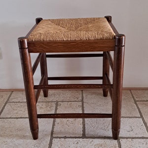 Vintage wooden stool with reed seat