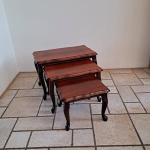 Set of three wooden queen Ann style nesting tables made in Romenia