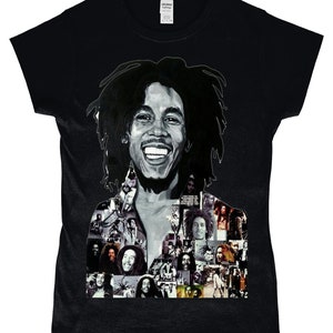 May include: Black t-shirt featuring a collage of images of Bob Marley. The main image is a close-up of Bob Marley smiling with his signature dreadlocks.