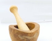 A mini rustic mortar and pestle made with olive wood, Tunisian made.