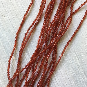 1.5mm Carnelian Faceted Rounds 1.5mm