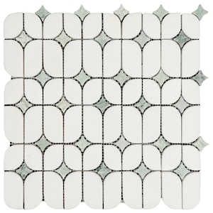 May include: White and green mosaic tile with a repeating pattern of elongated ovals and diamond shapes. The tile has a smooth, polished finish and is suitable for various design applications. The mosaic is made of small, individual tiles.