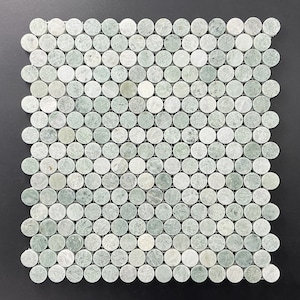 May include: A sheet of green marble mosaic tiles arranged in a grid pattern. Each tile is round and has a slightly irregular shape.