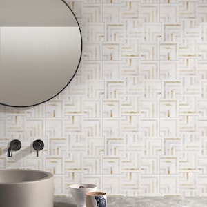 May include: A bathroom vanity with a round mirror, two black faucets, a gray ceramic sink, and a white tiled wall with a geometric pattern. Three ceramic bowls are on the counter.