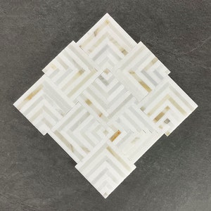 May include: White and gold geometric marble mosaic tile with a diamond shape.