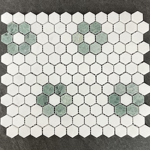 May include: White hexagonal marble mosaic tiles with green accents. The tiles are arranged in a honeycomb pattern.