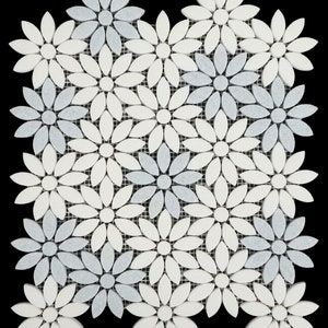 May include: A white and gray mosaic tile sheet featuring a repeating pattern of flower shapes. Each flower is made up of small, rounded pieces of marble.