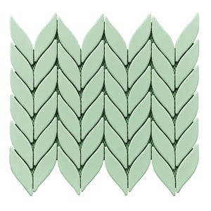 May include: A mosaic tile sheet featuring a repeating pattern of light green leaf-shaped tiles. The tiles are arranged in a chevron design, with a dark green mesh backing visible between the tiles. The overall effect is a decorative, nature-inspired design.