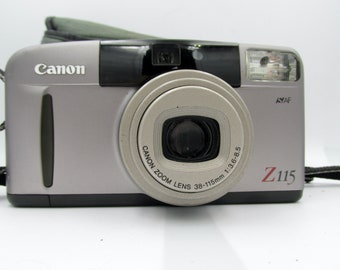 Appareil photo compact Canon Sure Shot Z115 35 mm avec zoom, viser et déclencher avec argentine avec étui, fonctionnel
