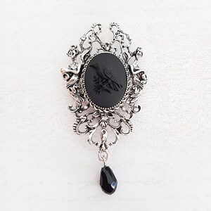 Poe silver brooch deals